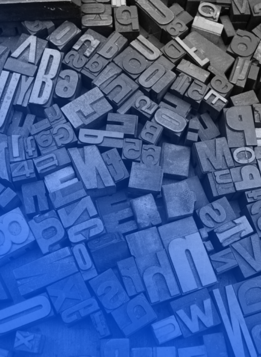 letters scattered on a wooden board.